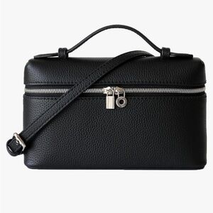 Top handle zip around vegan leather cross body bag with a luxury look silver zip